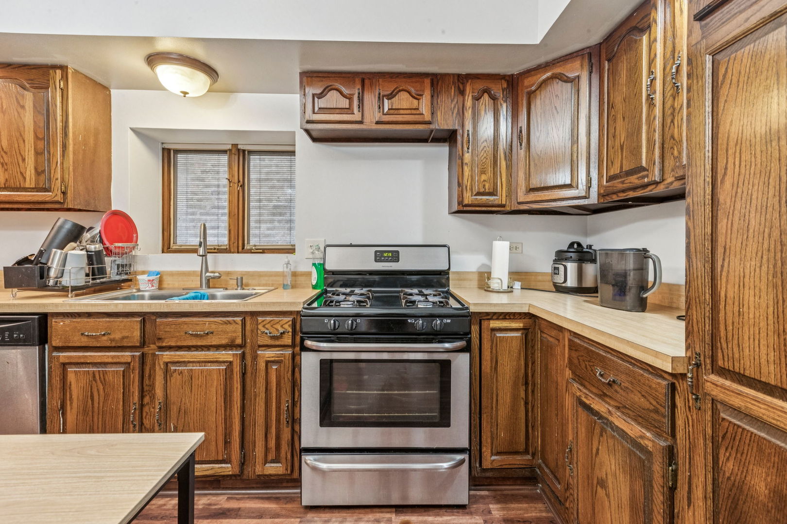 3234 South Princeton Avenue Chicago, IL 60616 - Photo 37 of 56 a kitchen with stainless steel appliances granite countertop a stove and cabinets