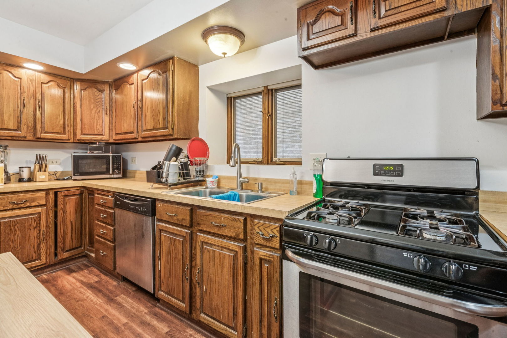 3234 South Princeton Avenue Chicago, IL 60616 - Photo 39 of 56 a kitchen with stainless steel appliances a stove a sink and cabinets