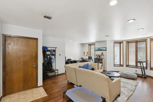 a living room with furniture and large window