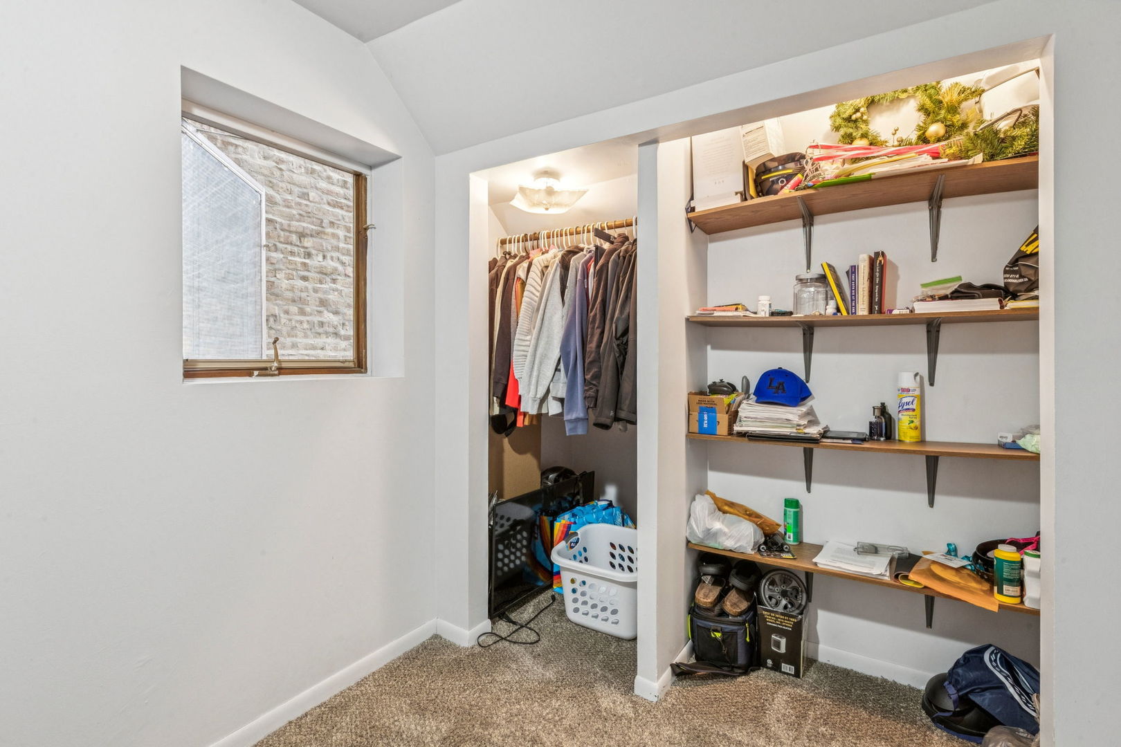 3234 South Princeton Avenue Chicago, IL 60616 - Photo 41 of 56 a view of walk in closet with clothes and shoes