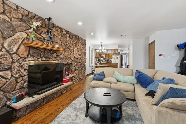 a living room with furniture and a fireplace