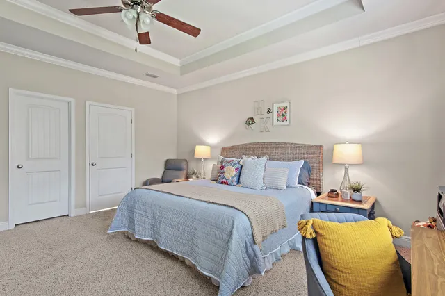 a bedroom with a bed and lamp