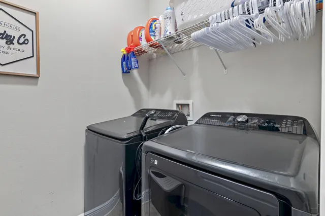a view of a swimming pool with a table and chairs