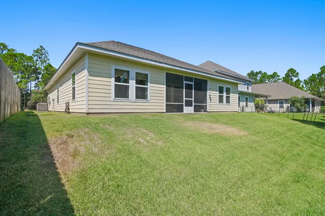 a garden with trees in front of it