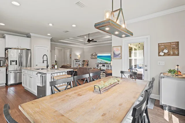 a large kitchen with sink cabinets and stainless steel appliances