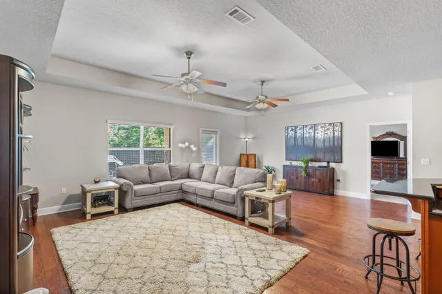 an aerial view of residential houses with outdoor space