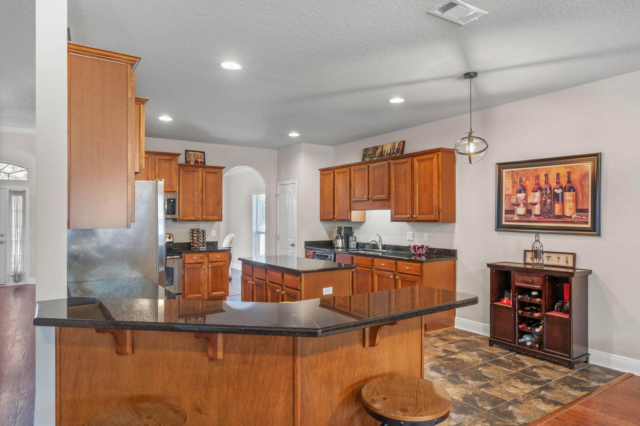 129 Mussett Bayou Court Santa Rosa Beach, FL 32459 - Photo 13 of 54 a kitchen with kitchen island granite countertop a sink cabinets and window