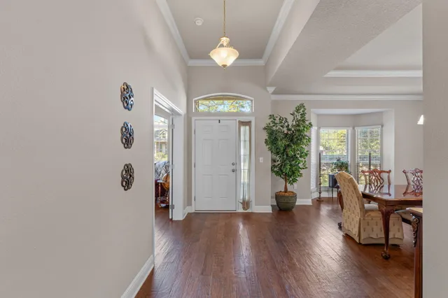a view of a dining room with furniture and window