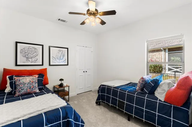 a bedroom with furniture and a window