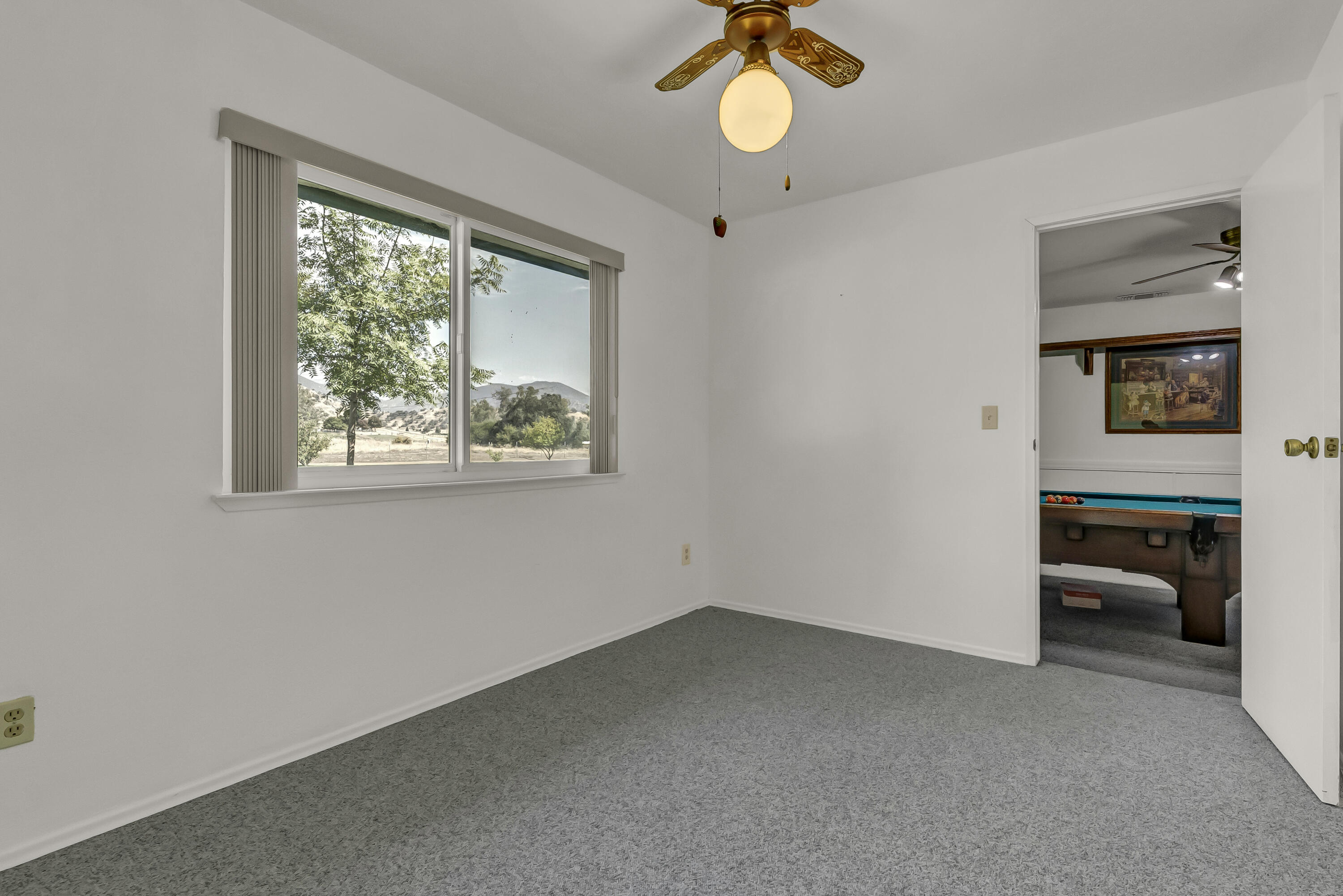 18002 320th Road Springville, CA 93265 - Photo 19 of 56 a view of a livingroom with a window and couch