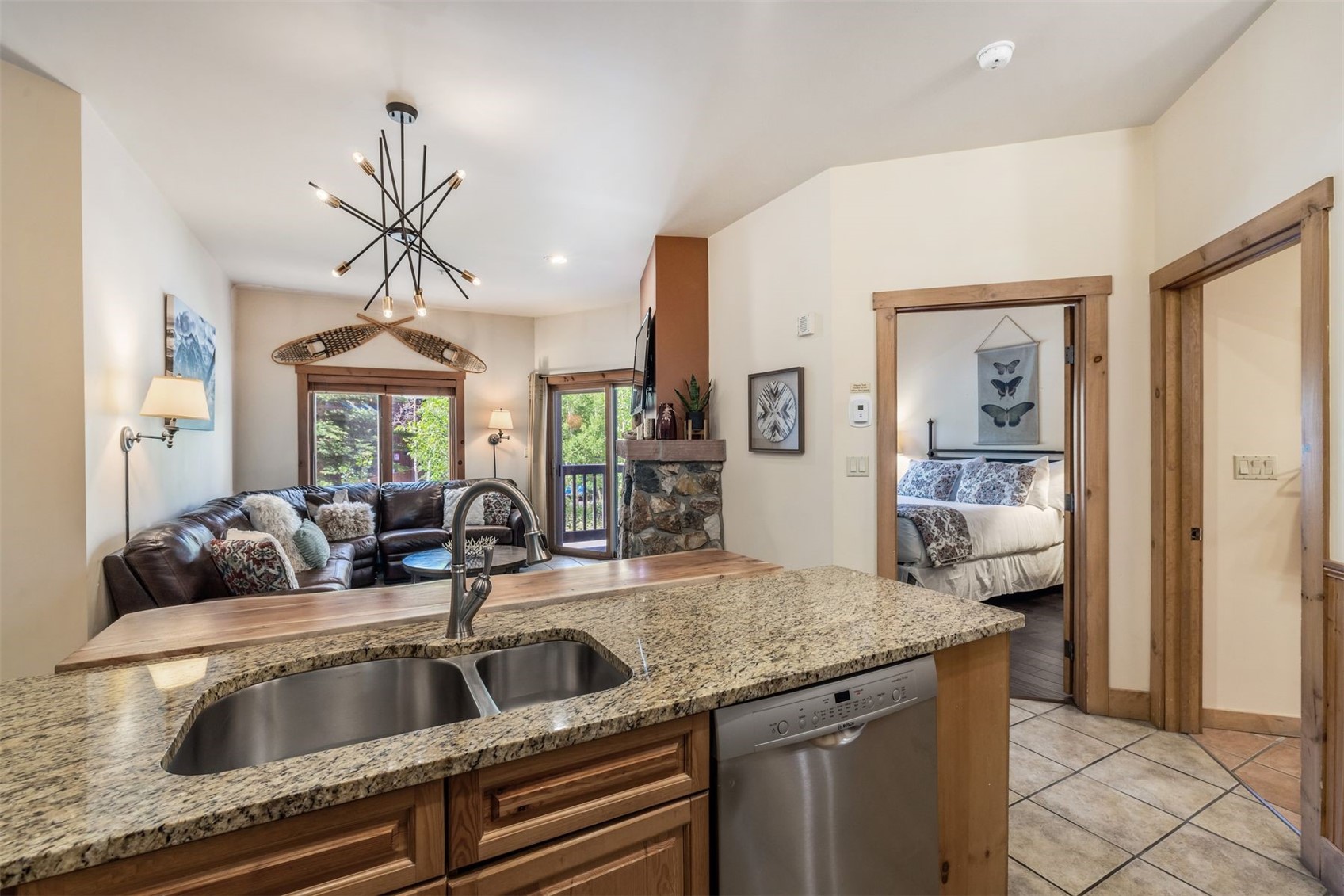 135 Dercum Drive, Unit 8565 Keystone, CO 80435 - Photo 12 of 38 a kitchen with a granite countertop sink and natural light