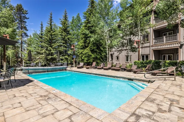 a view of swimming pool with chairs