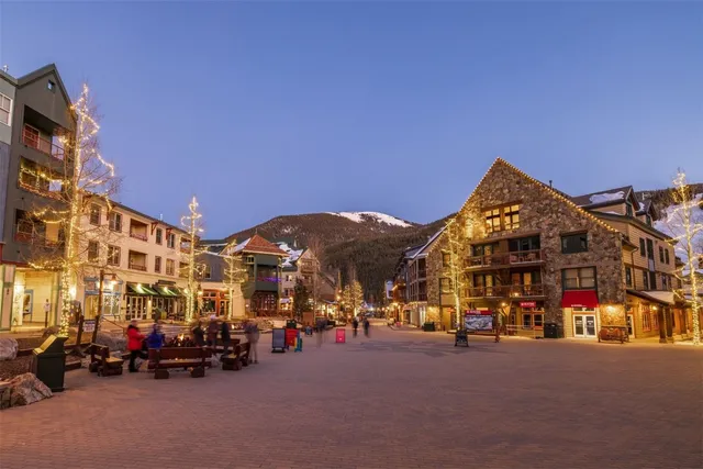 a view of a swimming pool with an outdoor space and seating area