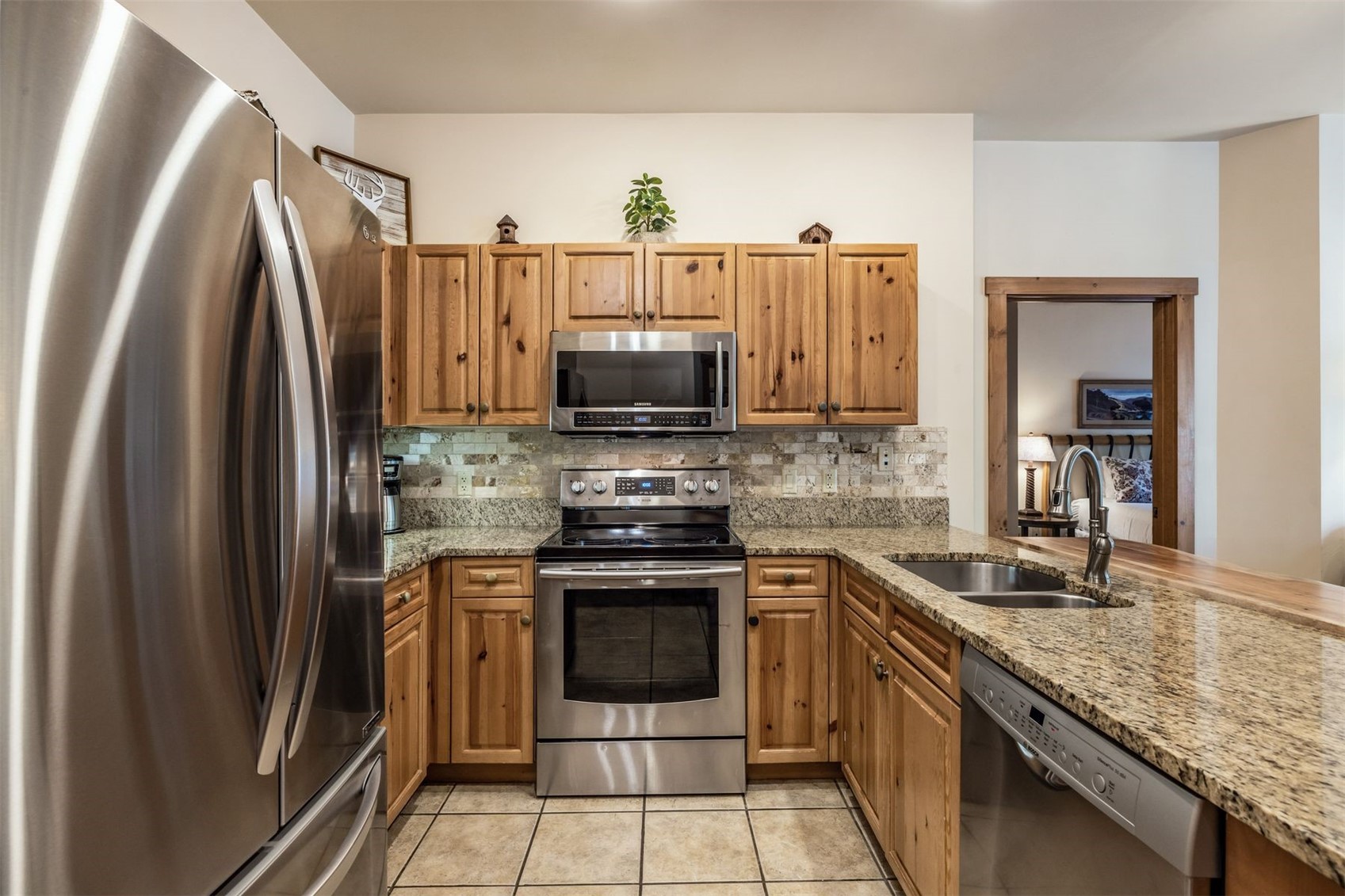 135 Dercum Drive, Unit 8565 Keystone, CO 80435 - Photo 9 of 38 a kitchen with stainless steel appliances granite countertop a stove a refrigerator and a sink