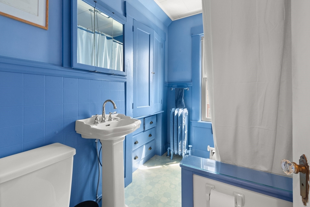 56 Washington Street Gloucester, MA 01930 - Photo 15 of 29 a bathroom with a sink and a toilet