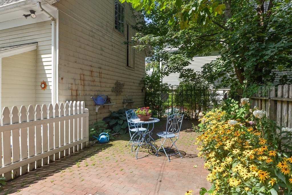 56 Washington Street Gloucester, MA 01930 - Photo 23 of 29 a view of a chair and table in backyard