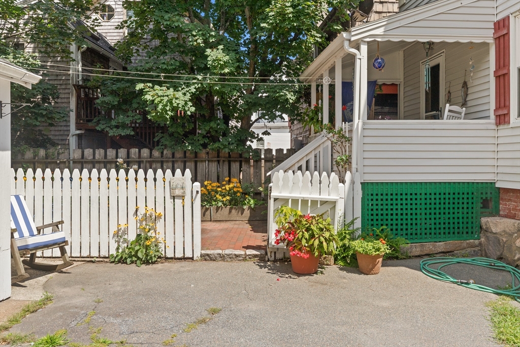 56 Washington Street Gloucester, MA 01930 - Photo 28 of 29 a view of a house with a garden and pathway