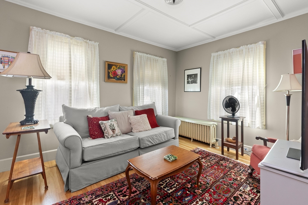 56 Washington Street Gloucester, MA 01930 - Photo 6 of 29 a living room with furniture and a window