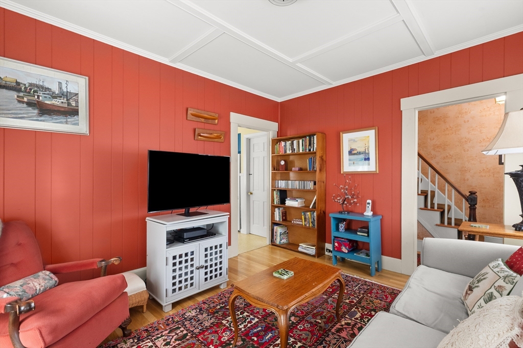 56 Washington Street Gloucester, MA 01930 - Photo 8 of 29 a living room with furniture and a flat screen tv