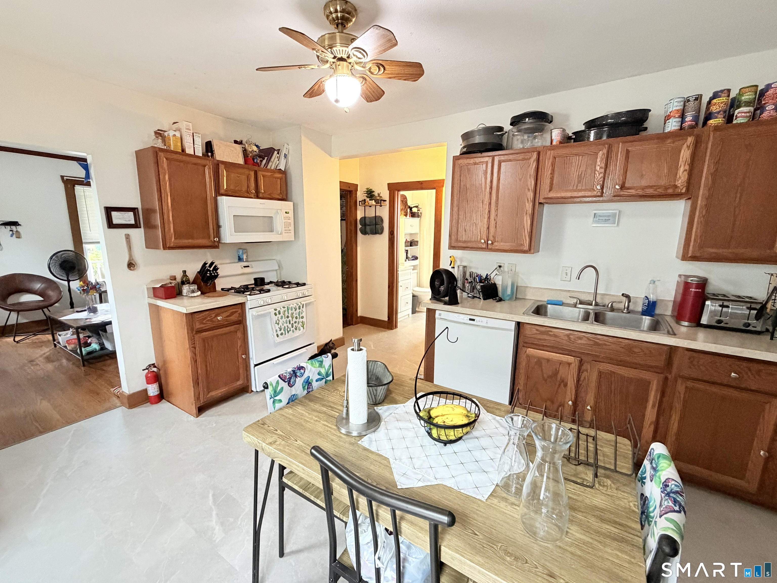 67 Pine Street Meriden, CT 06451 - Photo 7 of 34 a kitchen that has a table and chairs in it