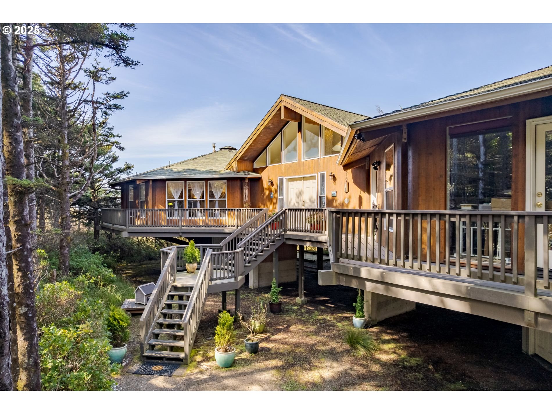 a view of a house with wooden deck