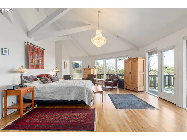 a living room with furniture fireplace and a large window