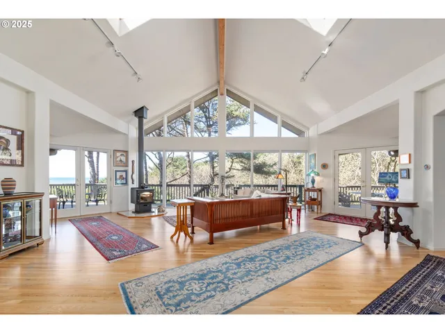 a living room with lots of furniture and a large window