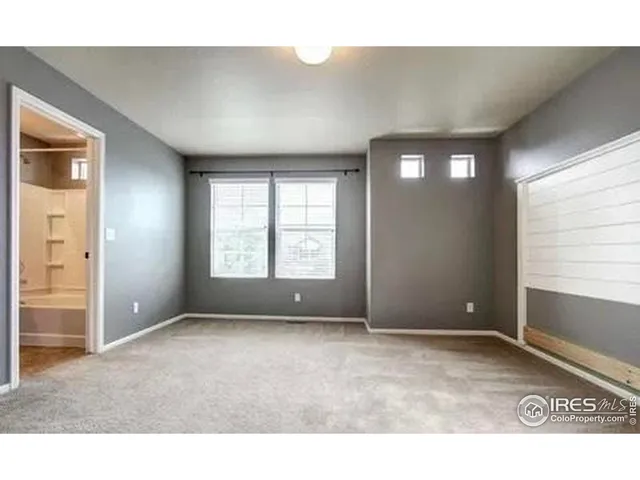 a room with windows and closet