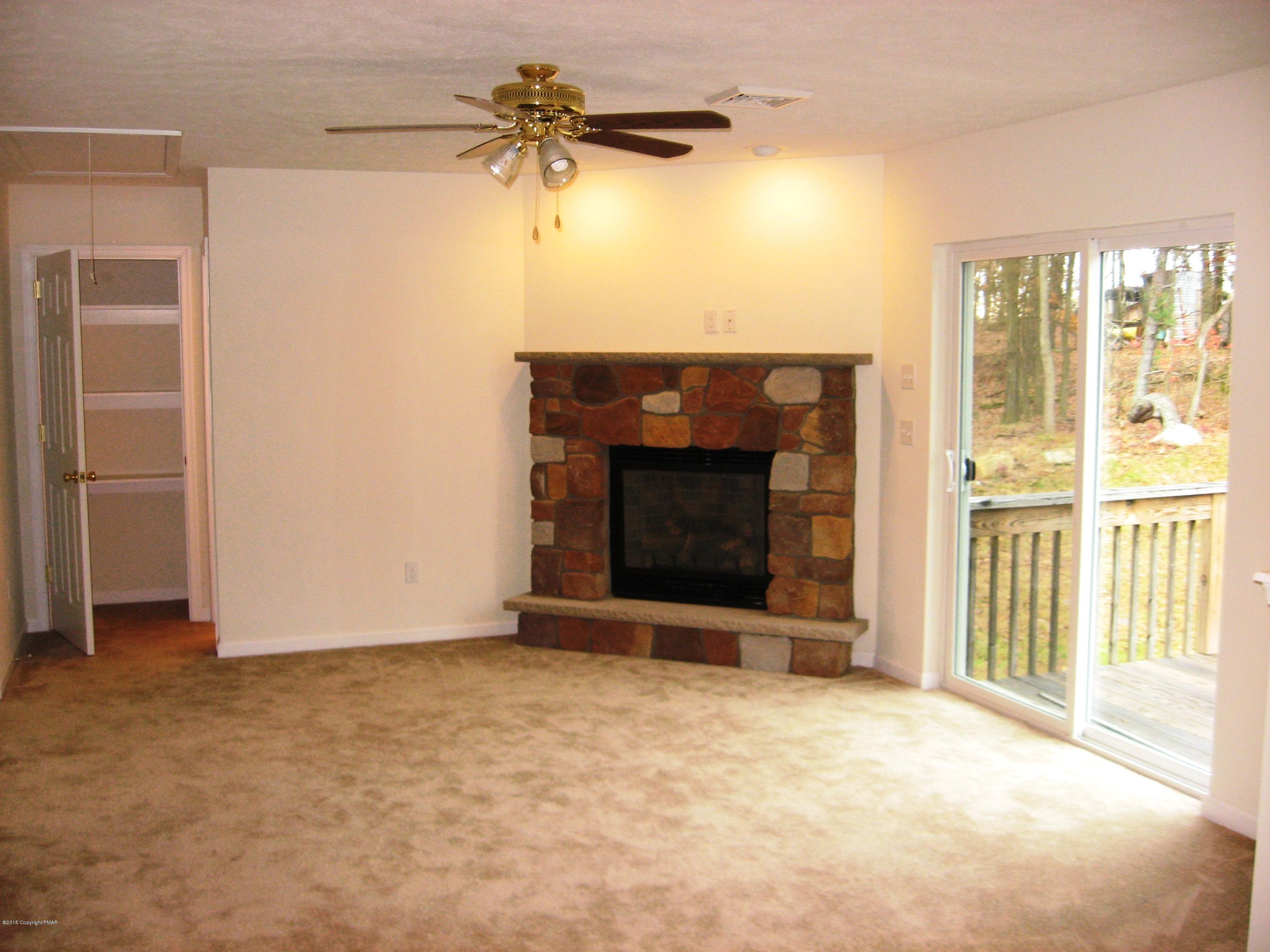 230 Sage Road Long Pond, PA 18334 - Photo 3 of 13 a view of an empty room with a fireplace