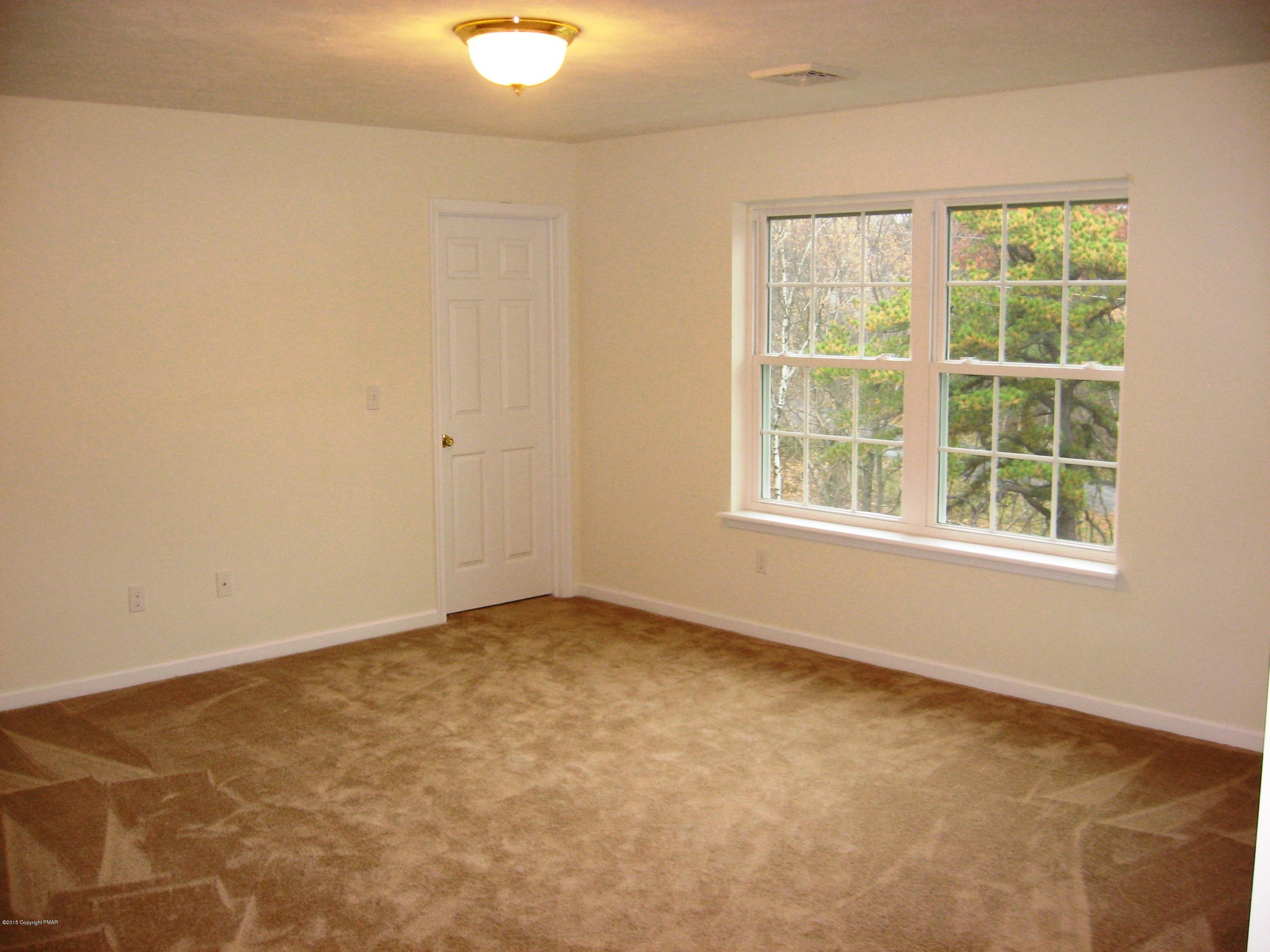 230 Sage Road Long Pond, PA 18334 - Photo 4 of 13 an empty room with a window