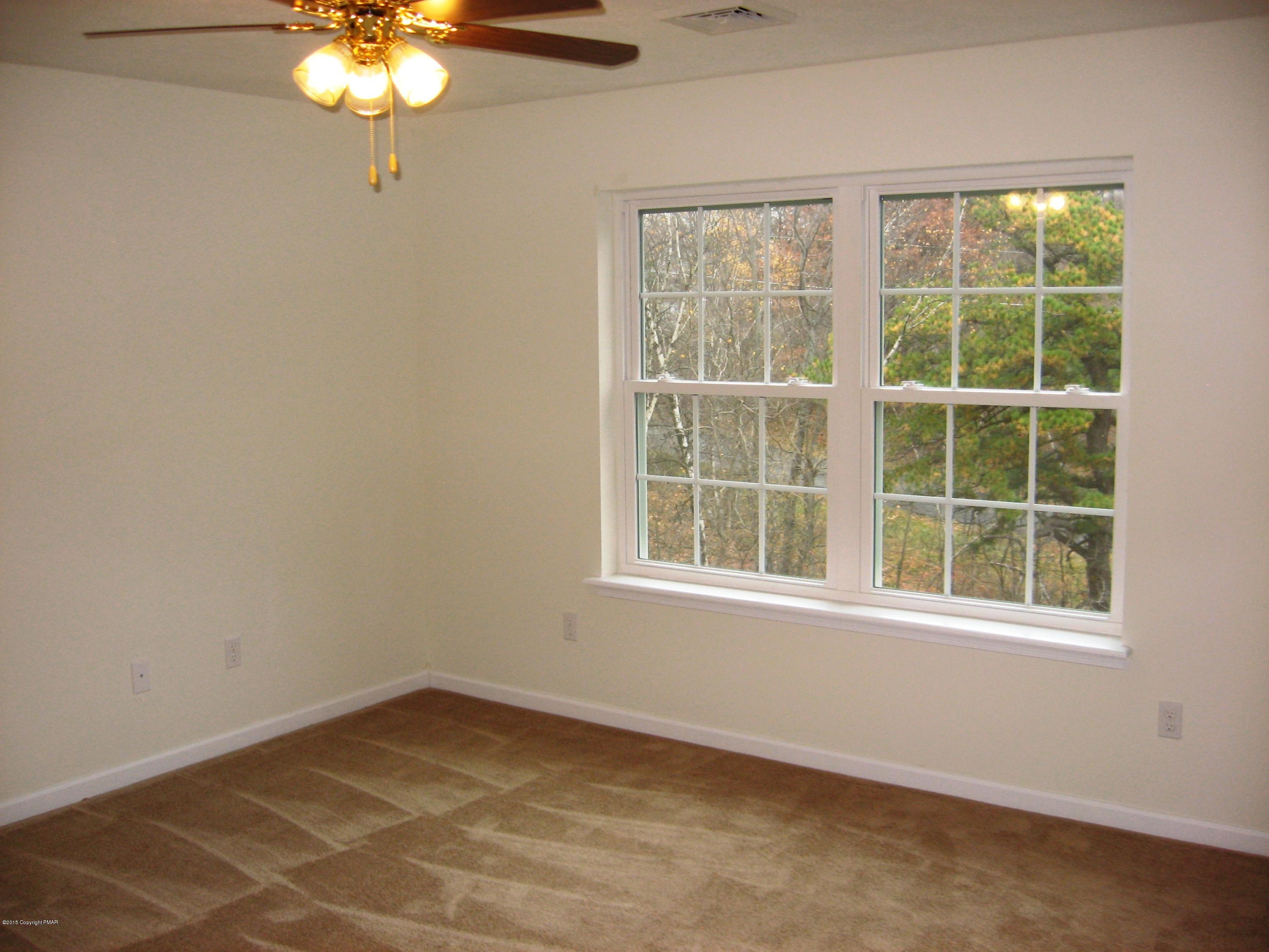 230 Sage Road Long Pond, PA 18334 - Photo 8 of 13 an empty room with a window