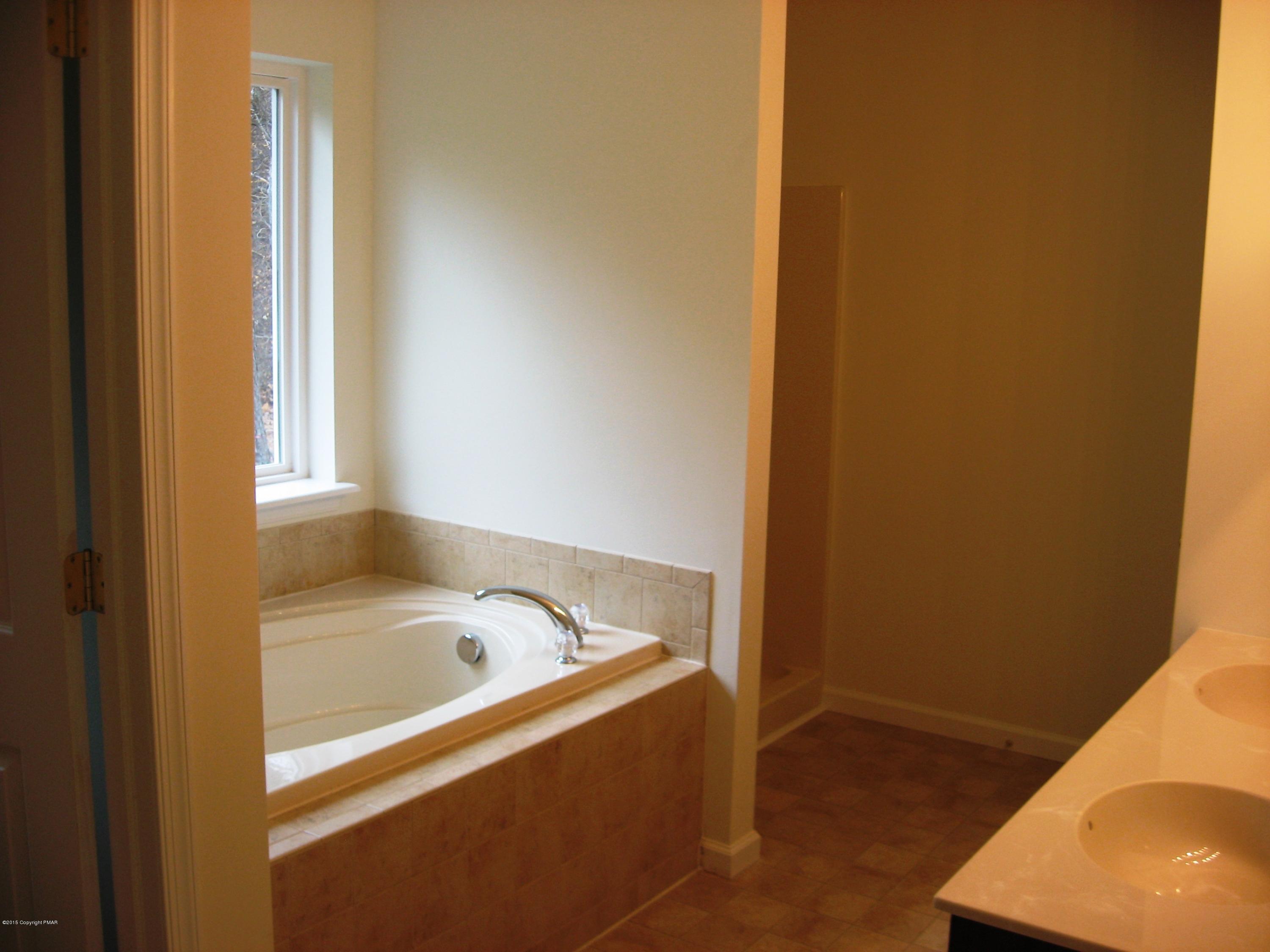 230 Sage Road Long Pond, PA 18334 - Photo 9 of 13 a bathroom with a bathtub