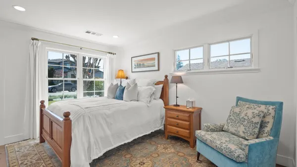 a bed room with a bed and a couch
