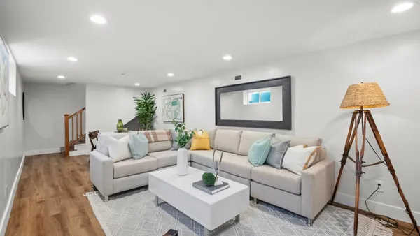 a living room with furniture and a rug