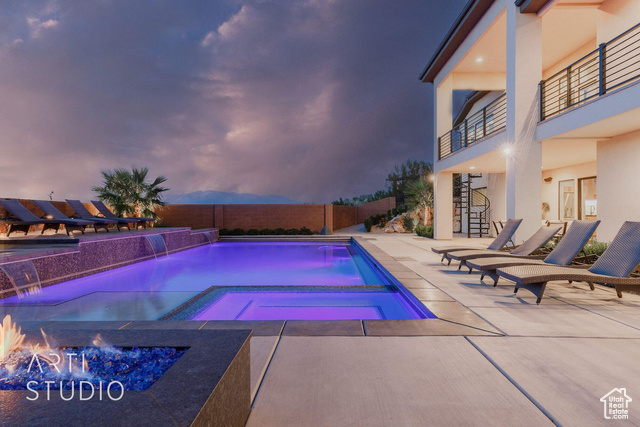 6026 Zen Trail Way St. George, UT 84790 - Photo 32 of 41 View of swimming pool with a fenced backyard, stairway, a patio, and a pool with connected hot tub