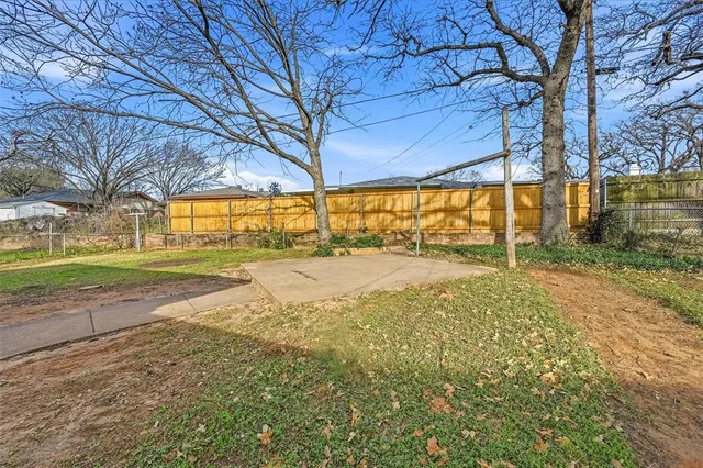 a view of yard with swimming pool