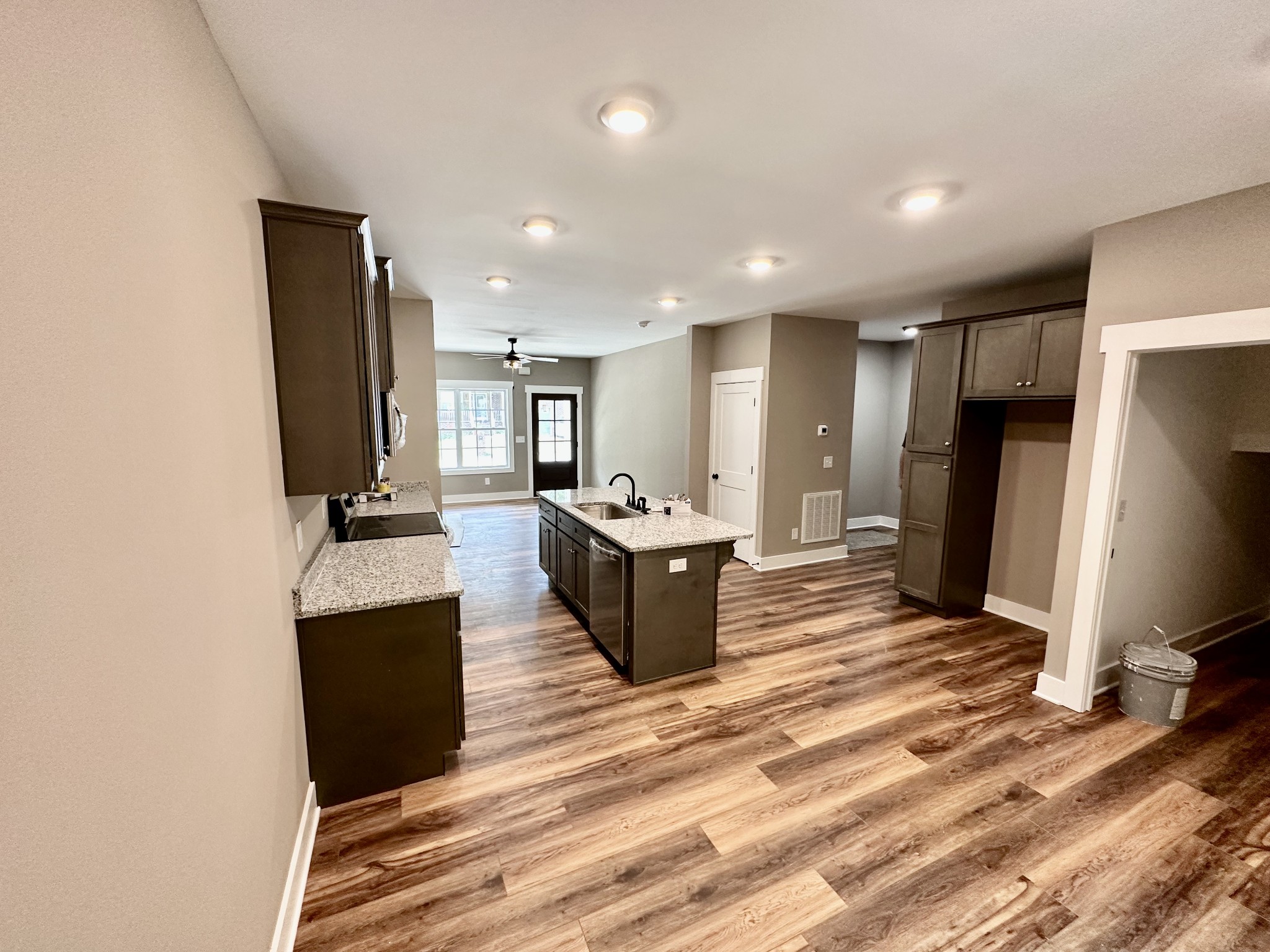 412 South Aztec Drive White House, TN 37188 - Photo 3 of 15 a view of a kitchen counter top space with stainless steel appliances kitchen island wooden floor and living room view