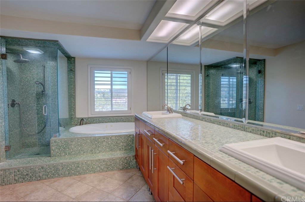 2 Chandon Newport Coast, CA 92657 - Photo 11 of 22 a bathroom with a granite countertop sink and shower