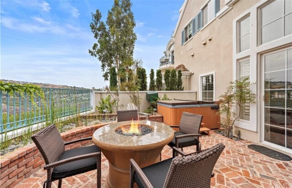 2 Chandon Newport Coast, CA 92657 - Photo 16 of 22 a view of a patio with table and chairs and potted plants