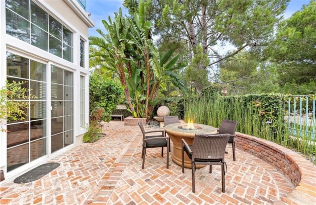 2 Chandon Newport Coast, CA 92657 - Photo 17 of 22 a table and chairs in front of a house
