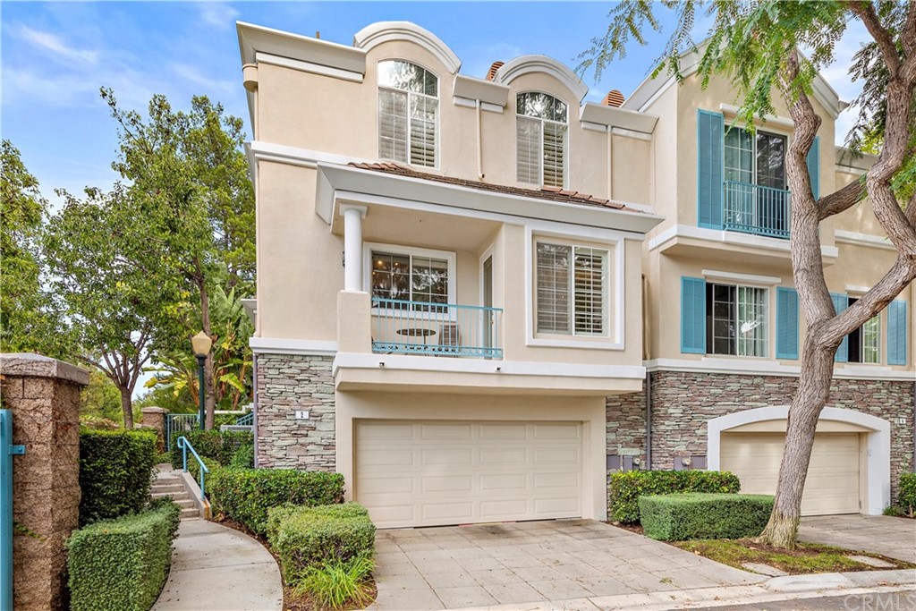 2 Chandon Newport Coast, CA 92657 - Photo 2 of 22 a front view of a house with garden