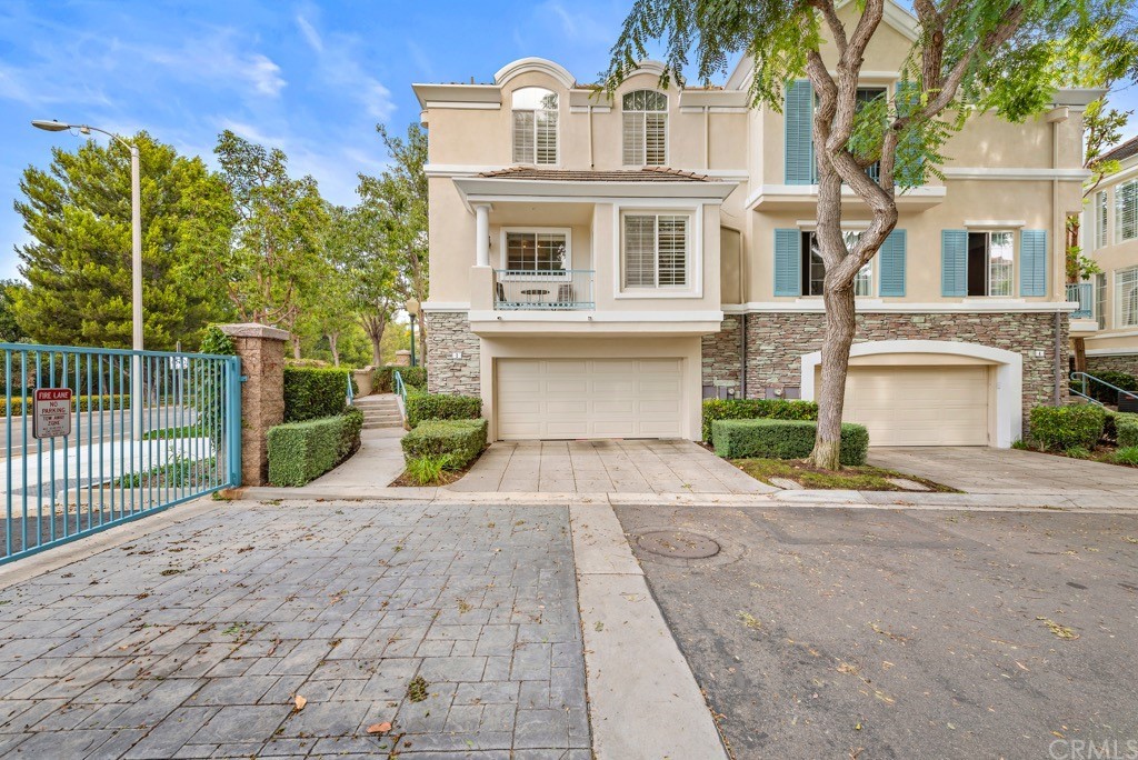 2 Chandon Newport Coast, CA 92657 - Photo 21 of 22 a front view of a house with a yard and garage