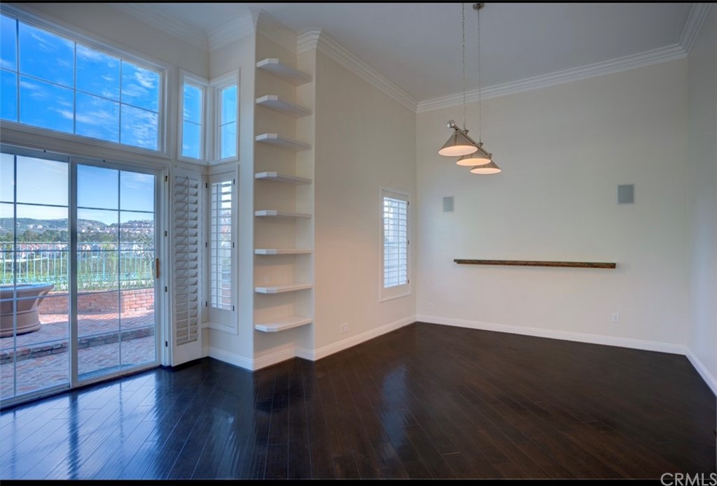 2 Chandon Newport Coast, CA 92657 - Photo 6 of 22 a view of an empty room with wooden floor and a window