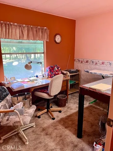 a view of a chairs and table in patio