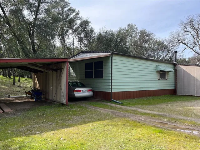 a view of a backyard with a car parked in it