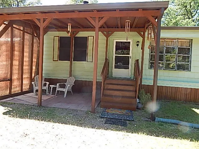 a view of a chairs and table in the patio