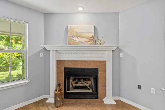 a living room with a fireplace and a fireplace