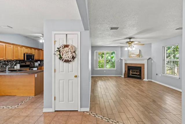 a view of a livingroom with an empty space and a fireplace