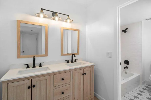 a bathroom with a bathtub and toilet