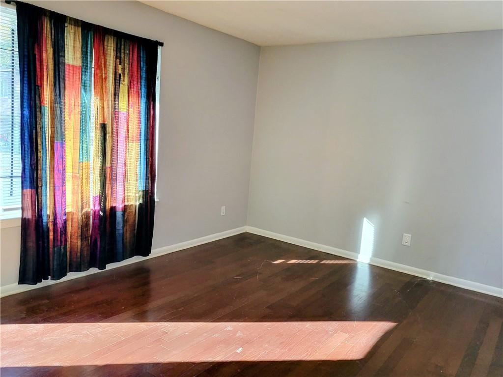 265 Peyton Place Southwest Atlanta, GA 30311 - Photo 2 of 7 a view of a room with wooden floor and walls